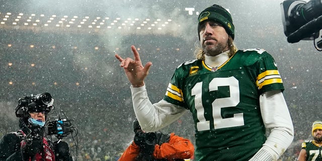 Quarterback Aaron Rodgers #12 of the Green Bay Packers gestures as he walks off the field after losing an NFC playoff game to the San Francisco 49ers at Lambeau Field on January 22, 2022 in Green Bay, Wisconsin. 