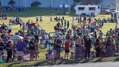 Kennedy Space Center employees and their families gathered to watch the stack of NASA's Artemis rockets move.