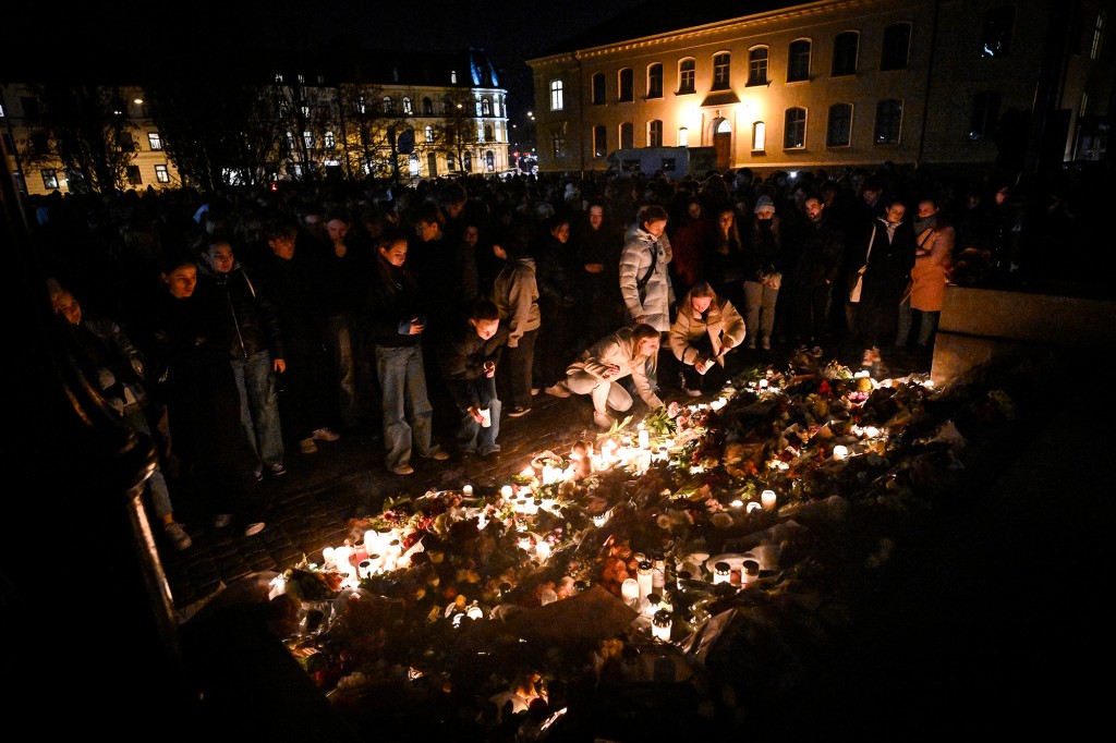 People pay tribute to the two teachers who were murdered at the Malmö Latin School on March 22, 2022.