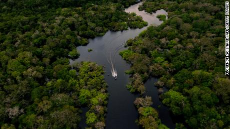 An aerial view of a speeding boat on the Gurora River in Karuari municipality, in the heart of the Brazilian Amazon rainforest, March 15, 2020. 