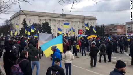 Citizens, waving Ukrainian flags and chanting, took to the streets of Kherson on Saturday, March 5, 2022 to protest against Russia's occupation.