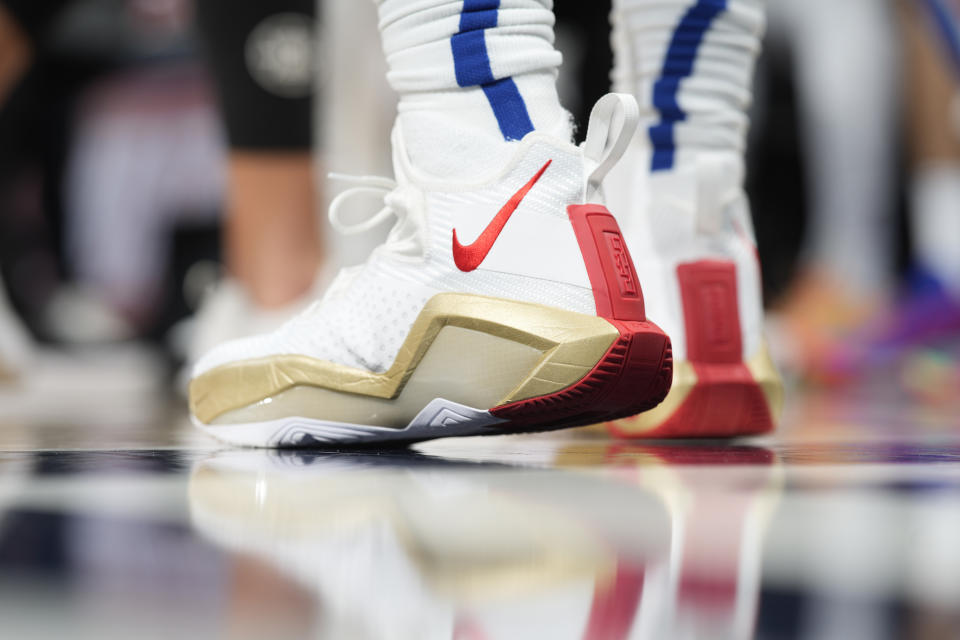 Nike basketball shoes worn by Los Angeles Clippers guard Eric Bledsoe (12) during the second half of an NBA basketball game on Wednesday, Jan. 19, 2022, in Denver.  The Nuggets won 130-128 in overtime.  (AP Photo/David Zalubowski)