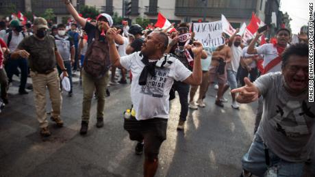 Demonstrators protest against the government of Peruvian President Pedro Castillo in Lima on Tuesday. 