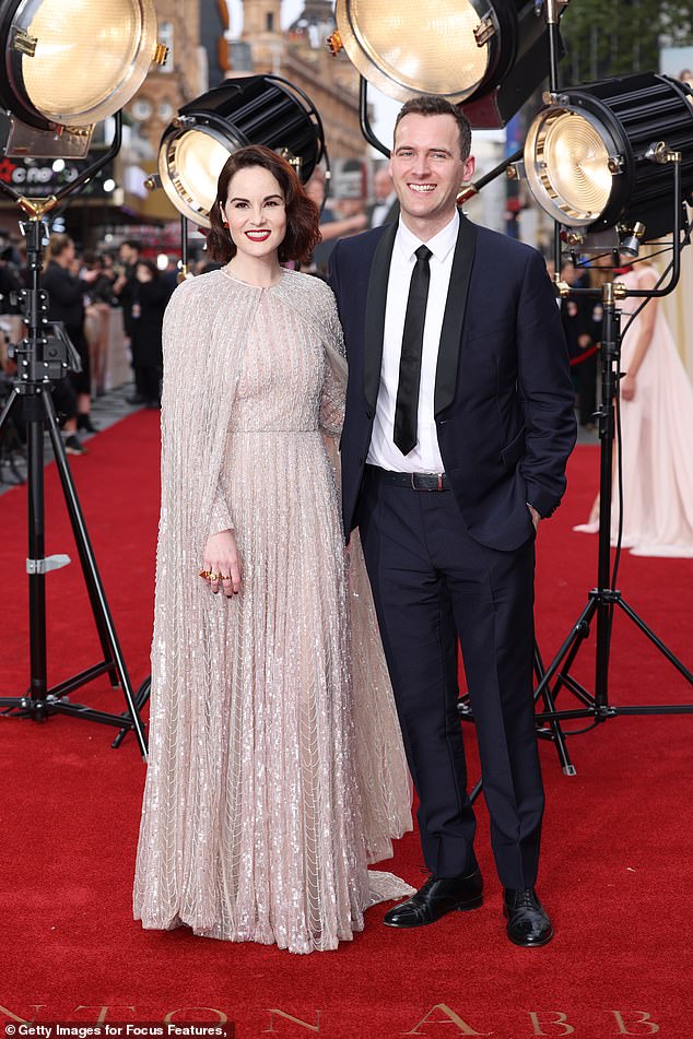 Gorgeous: The actress, who plays Mary Crawley on the series and its movie sequel, made sure all eyes were on her as she shimmered in a sexy dress, while posing next to her fiancé.