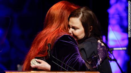 Ashley Judd (right) hugs her sister Winona at the induction party on Sunday.