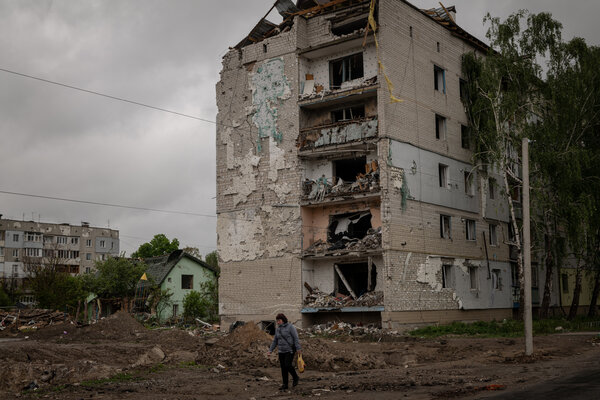 Walking past a damaged apartment block in the town of Borodianka, Ukraine, on Sunday.