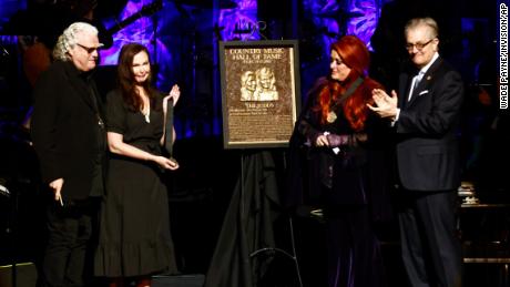 Winona Judd, second from right, standing next to The Judds'  Induction panel as Sister Ashley Judd, left, and Ricky Skaggs, M.  A look at the museum during the medal ceremony at the Country Music Hall of Fame on Sunday.