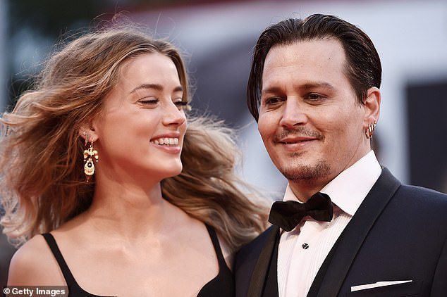 Happier times: Johnny wins a defamation trial after suing his ex-wife, Amber Heard, for $50 million over an article she wrote in 2018 that claimed she was a victim of domestic violence (pictured in 2015)